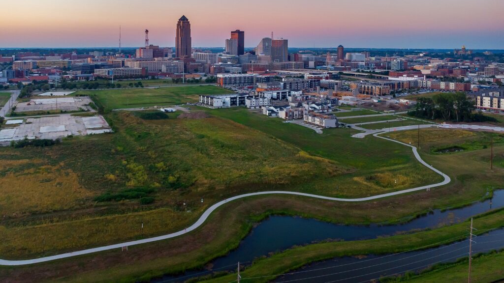 downtown des moines skyline at sunset with a bike trail