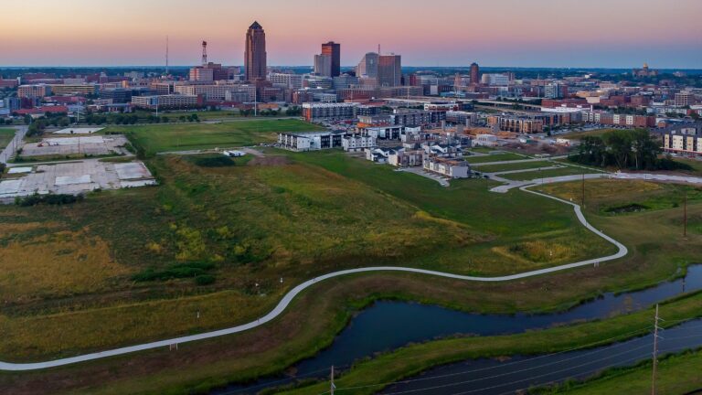 downtown des moines skyline at sunset with a bike trail
