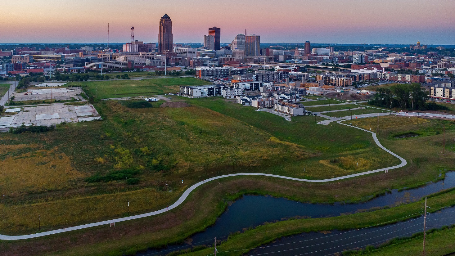 downtown des moines skyline at sunset with a bike trail