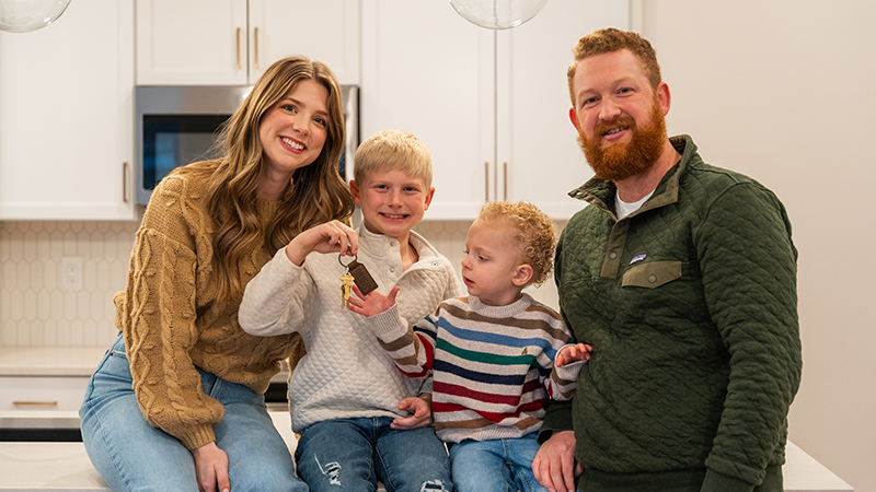Family of four enjoying their new home
