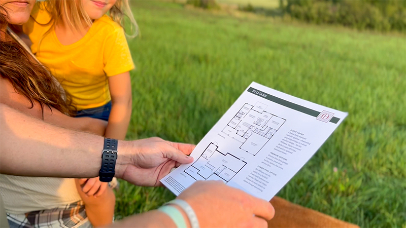 Family looking at a potential home layout