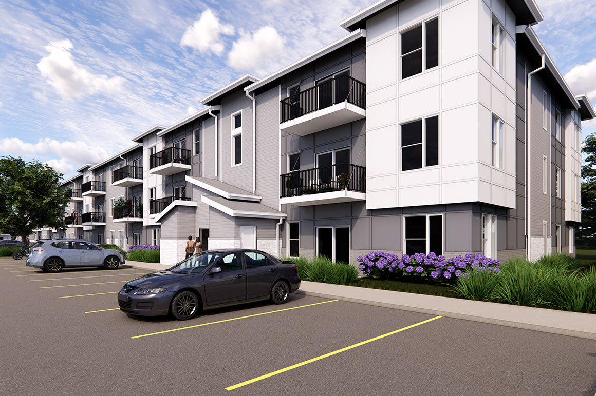 Rendering of a three‑story apartment building (The Rye at Harrison - Phase 1) with gray and white siding, black railings on balconies, and parking spaces along the front.