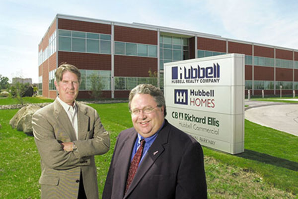 Rick Tollakson and Jim Hubbell in front of the Hubbell headquarters.