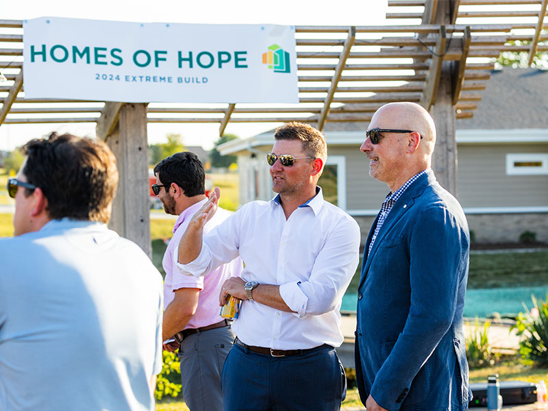 People talking at a charity event