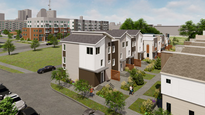 Rendering of Grays Station showing modern multi‑story townhomes with landscaped walkways, nearby parking areas, and apartment buildings in the background.