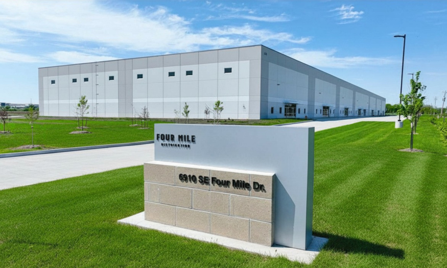 large industrial warehouse with sign in front