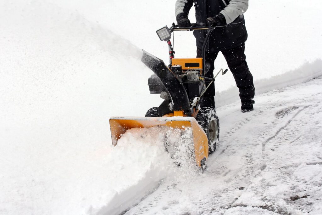 snow blower clearing snow