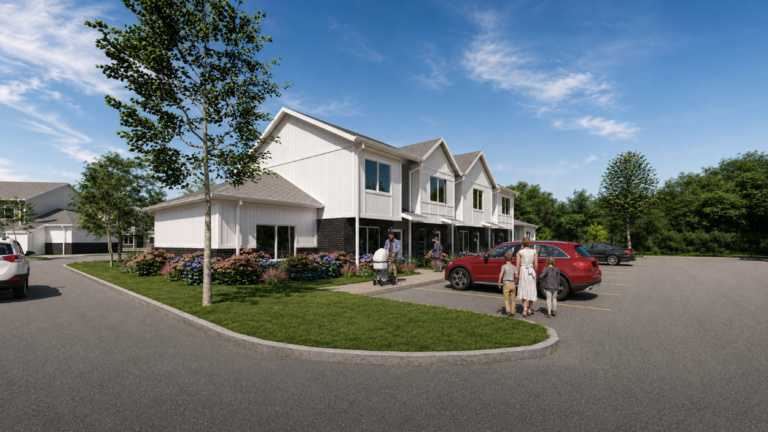 townhome community with people walking to front door